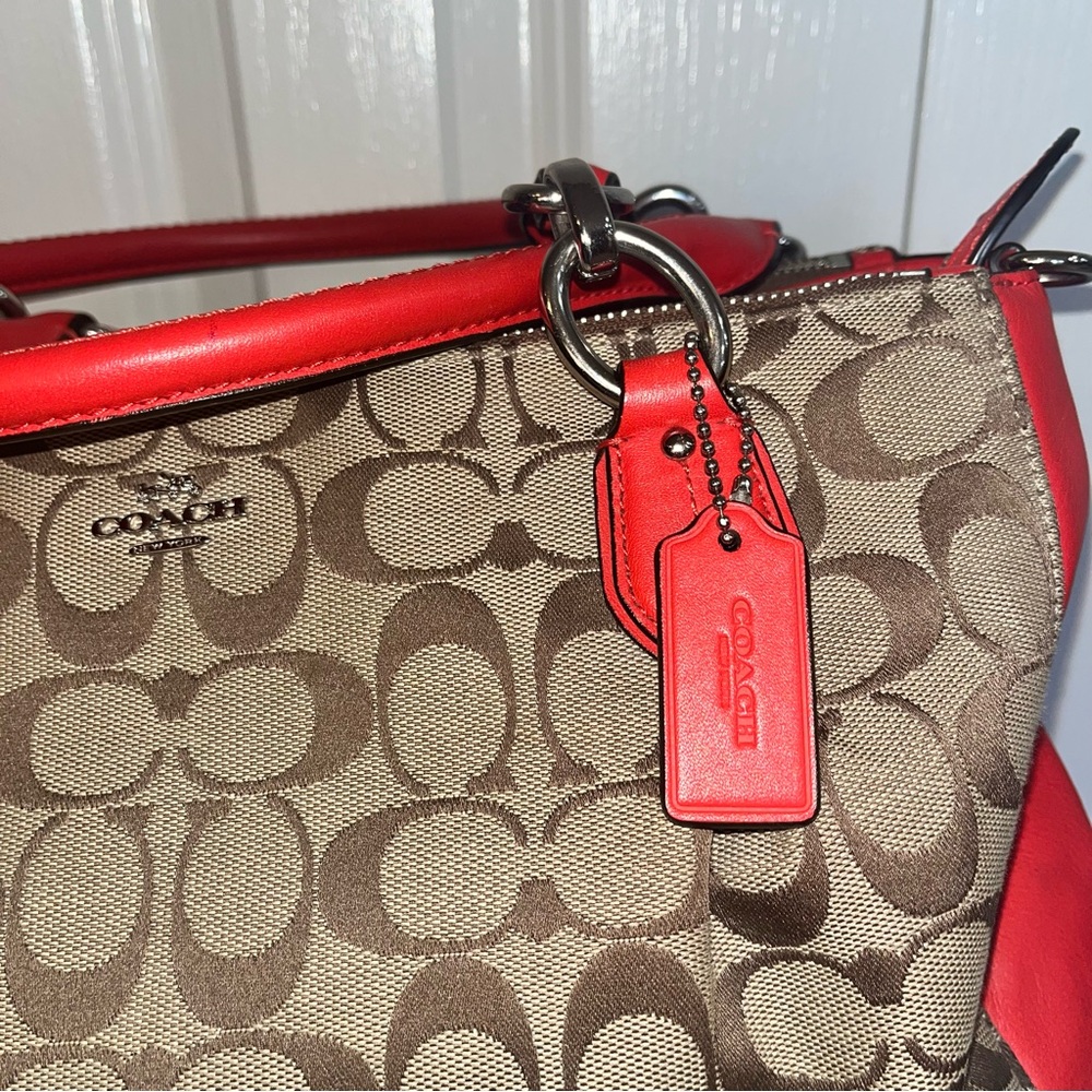 Coach Signature C
Beige Canvas w/ Orange Leather Trim Satchel Carryall Tote - Picture 2 of 12